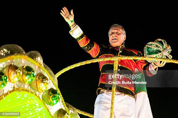 Brazilian former soccer player Zico guest of honor of Imperatriz Leopoldinense samba school waves to the crow during its parade at 2014 Brazilian...