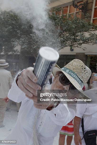 Reveller throws talcum powder during Los Indianos carnival on March 3, 2014 in Santa Cruz de La Palma, Spain. The origin of the 'Dia de los Indianos'...