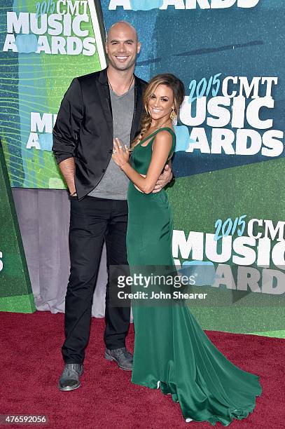 Player Mike Caussin and singer Jana Kramer attend the 2015 CMT Music awards at the Bridgestone Arena on June 10, 2015 in Nashville, Tennessee.