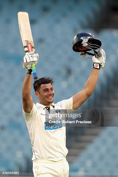 Marcus Stoinis of the Bushrangers celebrates scoring his century during day two of the Sheffield Shield match between Victoria and Tasmania at...