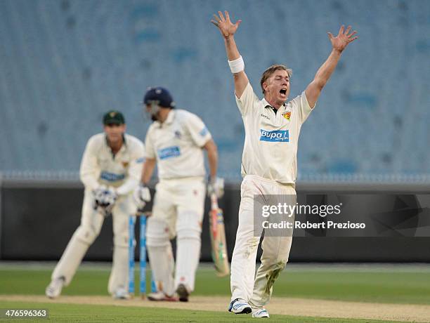 Xavier Doherty of the Tigers appeals successfully for the wicket of David Hussey of the Bushrangers during day two of the Sheffield Shield match...
