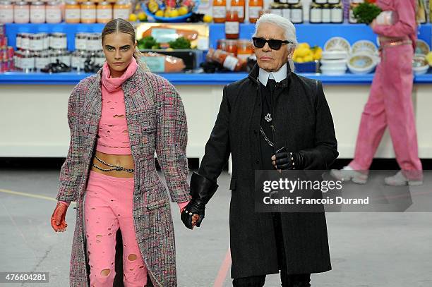 Fashion Designer Karl Lagerfeld and model Cara Delevingne appear at the end of the runway during the Chanel show as part of the Paris Fashion Week...