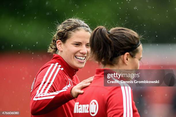 Annike Krahn of Germany reacts towards Dzsenifer Marozsan during a training session at Richcraft Recreation Complex on June 10, 2015 in Ottawa,...