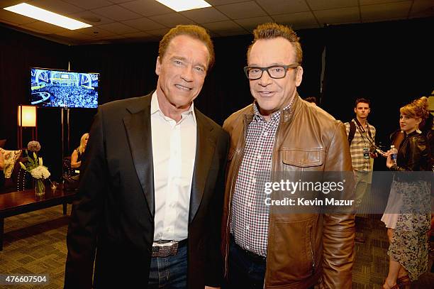 Arnold Schwarzenegger and Tom Arnold attend the 2015 CMT Music awards at the Bridgestone Arena on June 10, 2015 in Nashville, Tennessee.