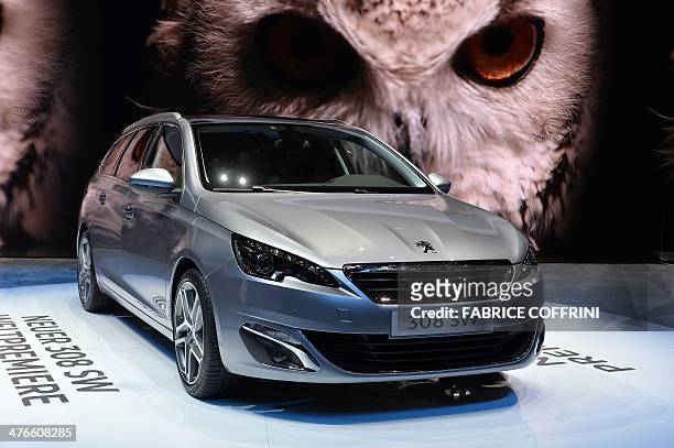 The new Peugeot 308 SW model car is displayd at the French carmaker's booth during the press day of the Geneva Motor Show in Geneva, on March 4,...