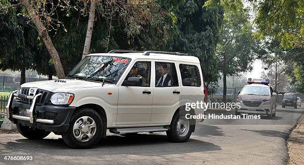 Sahara India Chief Subrata Roy leaves the guest house in Kalandi Kunj in police car to appear before Supreme Court on March 4, 2014 in New Delhi,...