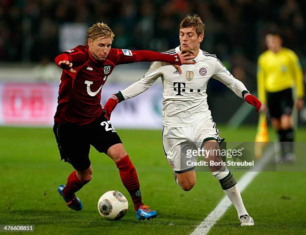 Frantisek Rajtoral of Hannover 96 challenges Toni Kroos of FC Bayern Muenchen during the Bundesliga match between Hannover 96 and FC Bayern Muenchen...