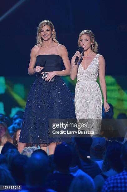 Hosts Erin Andrews and Brittany Snow speak onstage during the 2015 CMT Music awards at the Bridgestone Arena on June 10, 2015 in Nashville, Tennessee.