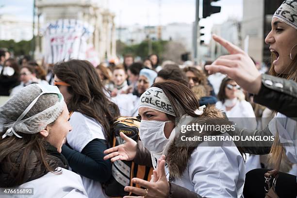 French nursing students shout slogans as they take part in a protest rally against a decision by private clinics to block nursing students from...