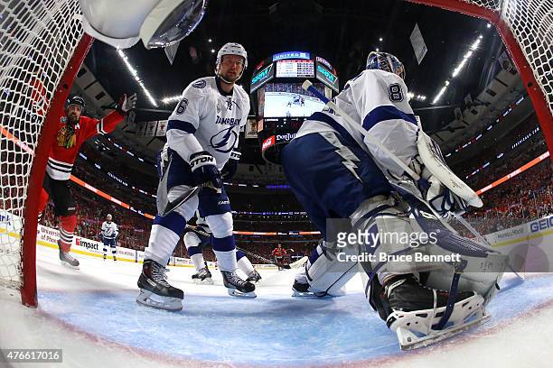Patrick Sharp of the Chicago Blackhawks reacts after a goal by Jonathan Toews on Andrei Vasilevskiy of the Tampa Bay Lightning during Game Four of...