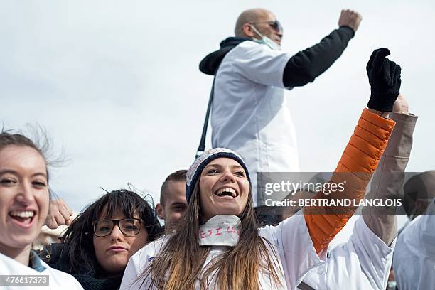 French nursing students shout slogans during a protest rally against a decision by private clinics to block nursing students from interning, in front...