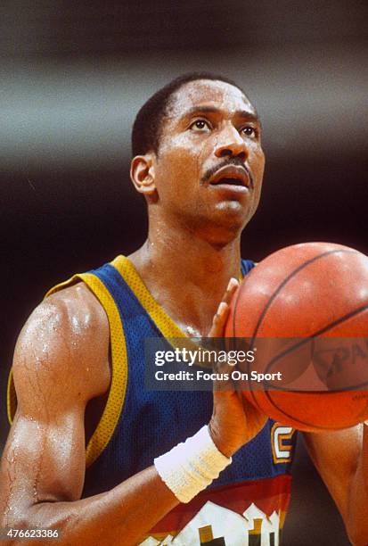Alex English of the Denver Nuggets shoots a free-throw against the Washington Bullets during an NBA basketball game circa 1982 at the Capital Centre...