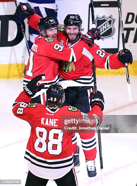 Brandon Saad celebrates with Brad Richards and Patrick Kane of the Chicago Blackhawks after scoring a goal in the third period against the Tampa Bay...