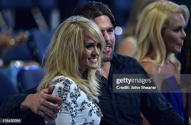 Singer Carrie Underwood and her husband Mike Fisher attend the 2015 CMT Music awards at the Bridgestone Arena on June 10, 2015 in Nashville,...