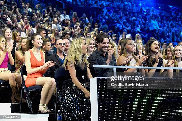 Singer Carrie Underwood and her husband Mike Fisher attend the 2015 CMT Music awards at the Bridgestone Arena on June 10, 2015 in Nashville,...