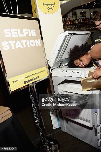 Actress-comedian Akilah Hughes takes a selfie at the selfie station during Shoebox's 29th Birthday Celebration hosted by Rob Riggle at The Improv on...