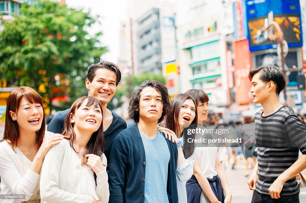 Young people  hanging out against cityscape