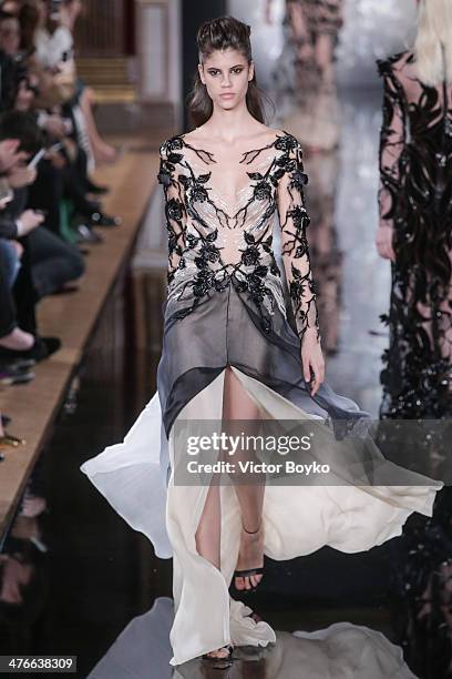 Model walks the runway during the Valentin Yudashkin show as part of the Paris Fashion Week Womenswear Fall/Winter 2014-2015 on March 4, 2014 in...