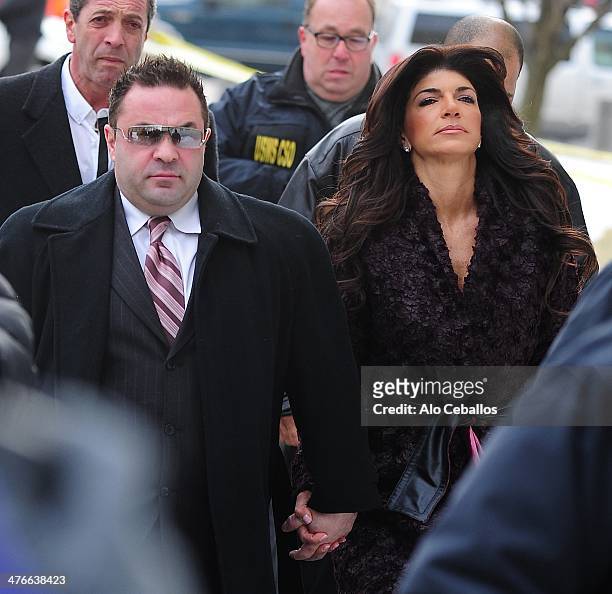 Teresa Giudice and Joe Giudice are seen outside a federal criminal court, where they face mortgage and bankruptcy fraud charges on March 4, 2014 in...