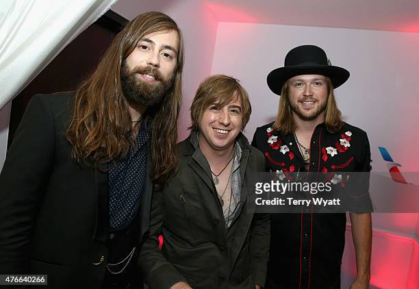 Graham Deloach, Bill Satcher and Michael Hobby of A Thousand Horses attend the American Airlines Suite during 2015 CMT Music Awards at Bridgestone...