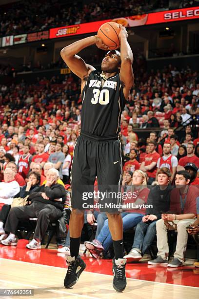 Travis McKie of the Wake Forest Demon Deacons takes a jump shot during a college basketball game against the Maryland Terrapins on February 18, 2014...