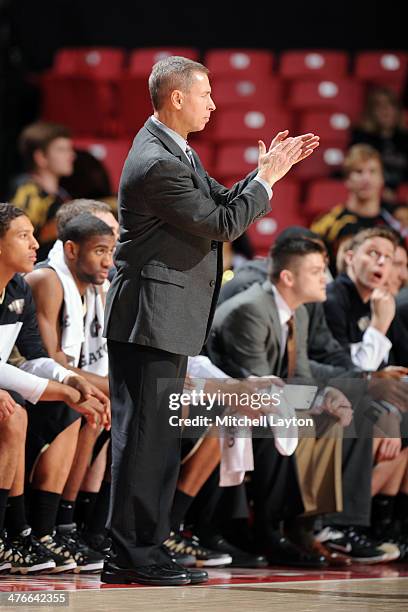 Head coach Jeff Bzdelik of the Wake Forest Demon Deacons cheers his players during a college basketball game against the Maryland Terrapins on...