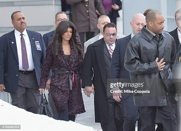 Teresa Giudice and Joe Giudice leave court after facing charges of defrauding lenders, illegally obtaining mortgages and other loans as well as...