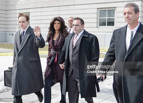 Teresa Giudice and Joe Giudice leave court after facing charges of defrauding lenders, illegally obtaining mortgages and other loans as well as...