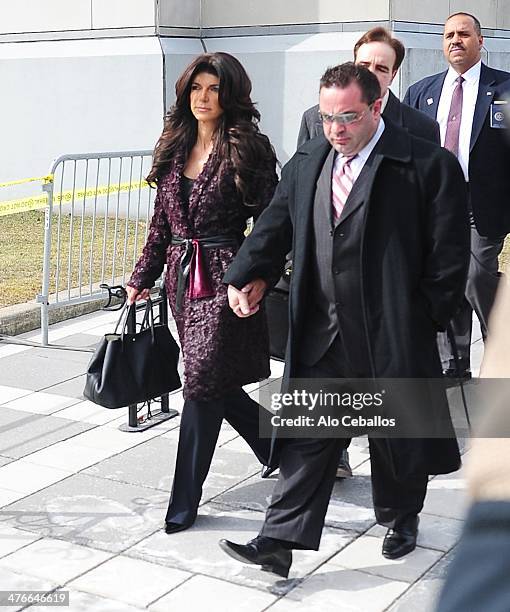 Teresa Giudice and Joe Giudice are seen outside a federal criminal court, where they face mortgage and bankruptcy fraud charges on March 4, 2014 in...