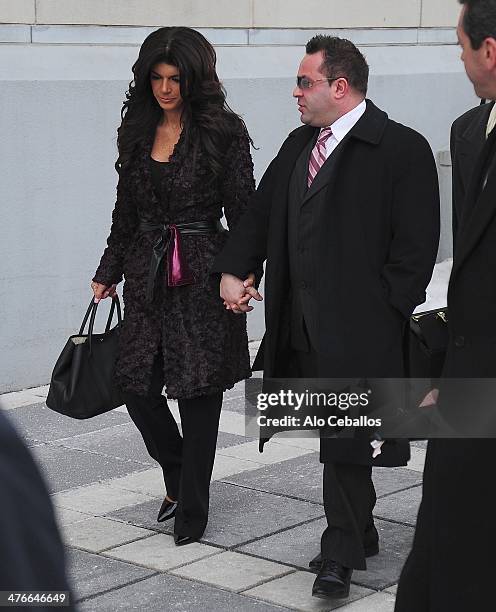 Teresa Giudice and Joe Giudice are seen outside a federal criminal court, where they face mortgage and bankruptcy fraud charges on March 4, 2014 in...