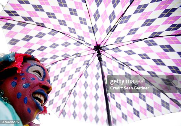 Members of the Krew of Mondo Kayo Social Marching Club parde Mardi Gras day in the rain on March 4, 2014 in New Orleans, Louisiana. Fat Tuesday, the...