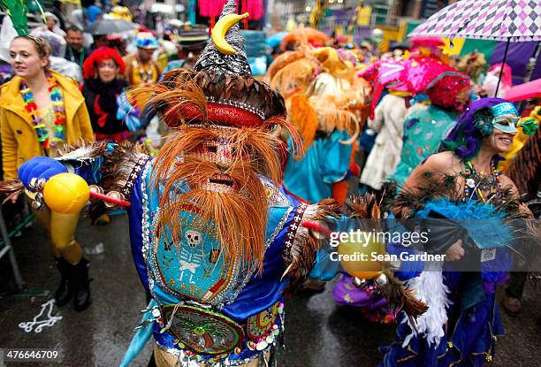 Members of the Krew of Mondo Kayo Social Marching Club parde Mardi Gras day in the rain on March 4, 2014 in New Orleans, Louisiana.