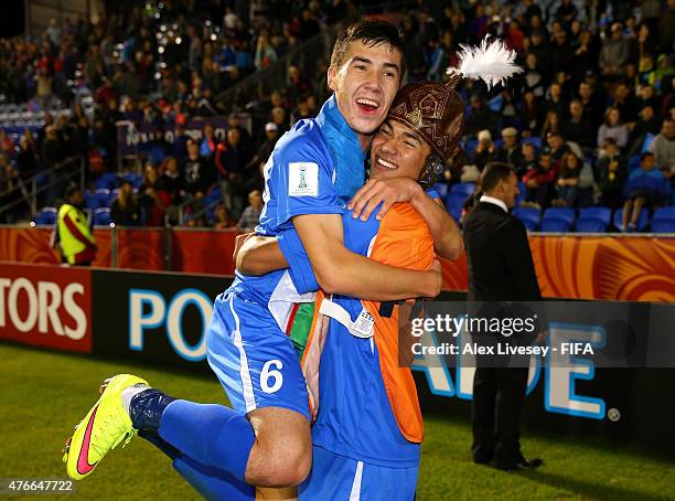 The goalscorer Dostonbek Khamdamov of Uzbekistan celebrates with Akramjon Komilov after victory over Austria in the FIFA U-20 World Cup round of 16...
