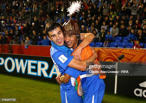 The goalscorer Dostonbek Khamdamov of Uzbekistan celebrates with Akramjon Komilov after victory over Austria in the FIFA U-20 World Cup round of 16...