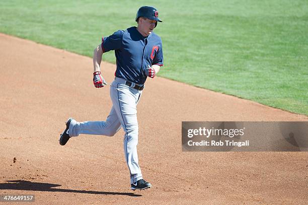 Elliot Johnson of the Cleveland Indians rounds the base after hitting a home run at Goodyear Ballpark on February 27, 2014 in Goodyear, Arizona.