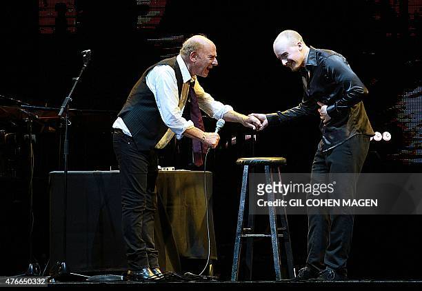 Grammy Award-winning American singer Art Garfunkel performs with his son James on stage at the Bloomfield Stadium in the Israeli city of Tel Aviv, on...