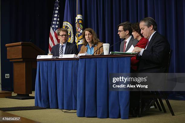 Office of Management and Budget Director Sylvia Burwell speaks as White House Press Secretary Jay Carney , Chairman of Council of Economic Advisers...