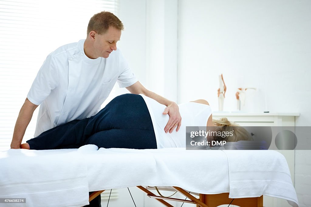 Woman receiving osteopathic therapy