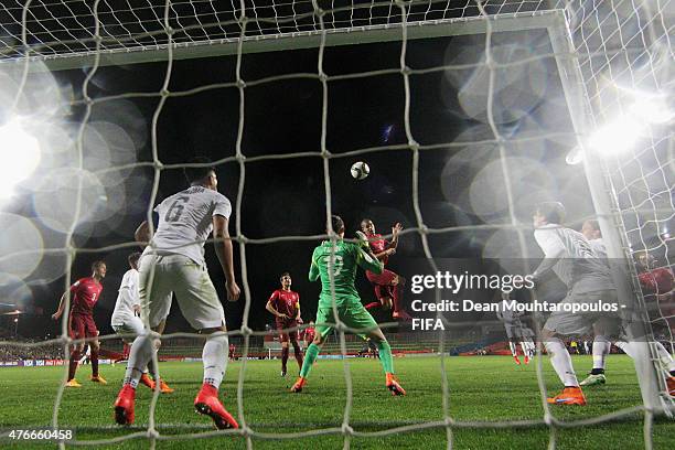 Andre Silva of Portugal heads on goal over the bar past goalkeeper, Nikola Tzanev of New Zealand during the FIFA U-20 World Cup New Zealand 2015...