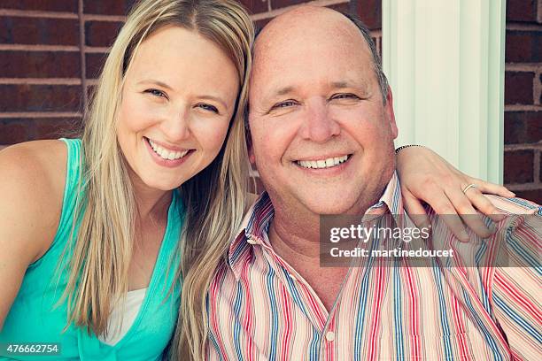 mature father and adult daughter portrait outdoors. - front porch stock pictures, royalty-free photos & images