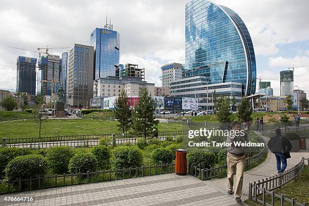 Residents walk through a downtown garden on June 11, 2015 in Ulaanbaatar, Mongolia. A few years ago, Mongolia boasted one of the world's fastest...