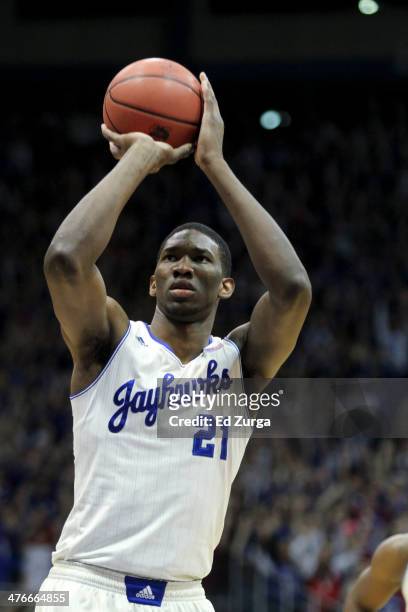 Joel Embiid of the Kansas Jayhawks shoots a free throw during a game against the Oklahoma Sooners at Allen Fieldhouse on February 24, 2014 in...