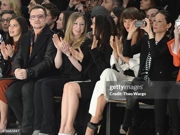 Bono, Chelsea Clinton, Helena Christensen and Lucy Lui attend the Edun fashion show during Mercedes-Benz Fashion Week Fall 2014 at Skylight Modern on...