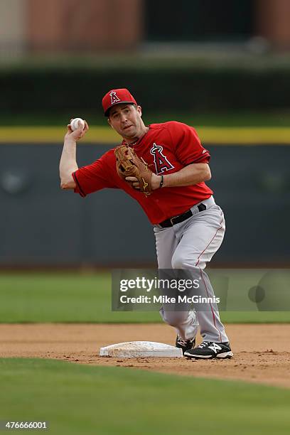 John McDonald of the Los Angeles Angels runs a infield drill during a workout at Tempe Diablo Stadium practice facility on February 25, 2014 in...