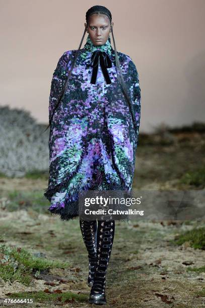 Model walks the runway at the Alexander McQueen Autumn Winter 2014 fashion show during Paris Fashion Week on March 4, 2014 in Paris, France.