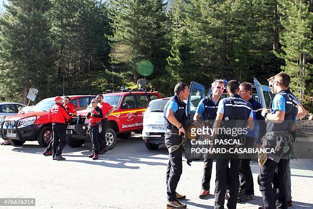 Gendarmes and firemen prepare for the research of missing people in the GR 20 hiking trail on June 11 near Asco in the French Mediterranean island of...