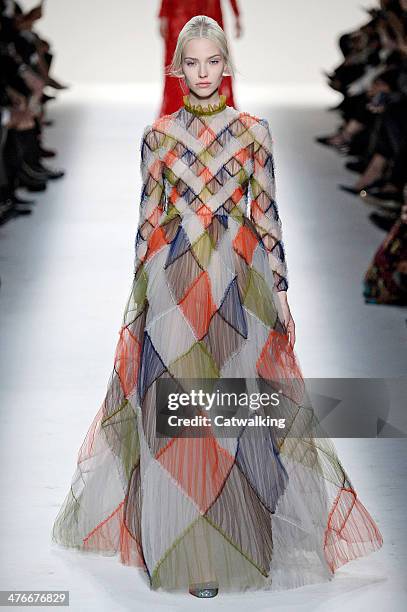 Model walks the runway at the Valentino Autumn Winter 2014 fashion show during Paris Fashion Week on March 4, 2014 in Paris, France.