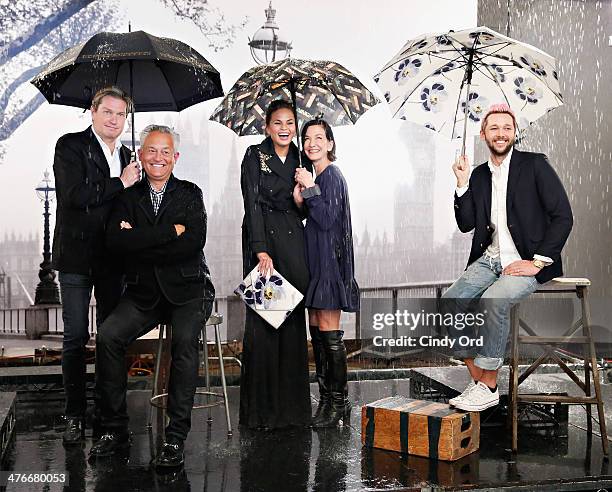 Fashion designers Mark Badgley, James Mischka, Cynthia Rowley and Chris Benz participate in a photo shoot with model Chrissy Teigen as Chrissy Teigen...