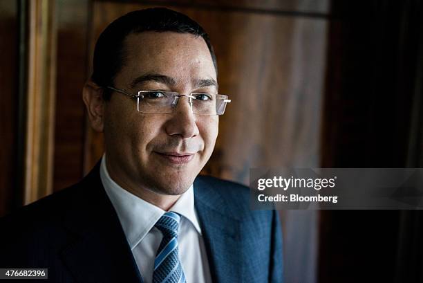 Victor Ponta, Romania's prime minister, poses for a photograph following an interview at the Victoria Palace in Bucharest, Romania, on Thursday, June...