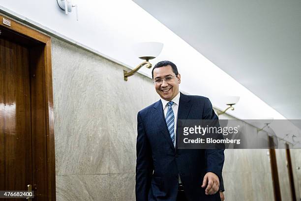 Victor Ponta, Romania's prime minister, exits following an interview at the Victoria Palace in Bucharest, Romania, on Thursday, June 11, 2015. A...